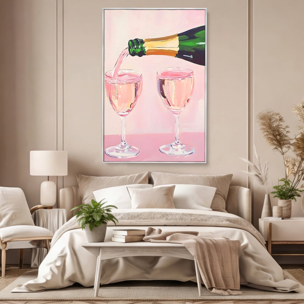 Tablou canvas cu pictura cu sticla si pahare de sampanie roz, in rama de aluminiu argintiu, pe perete intr-un dormitor